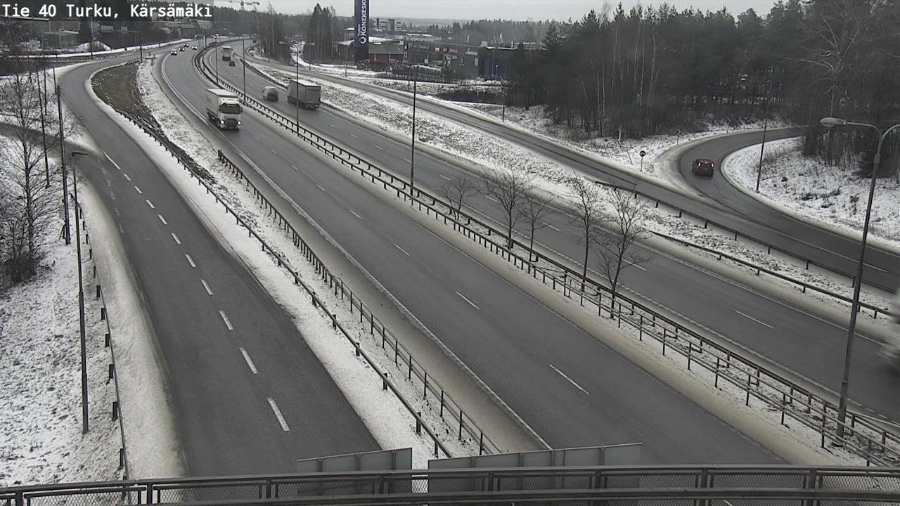 Low μ winter road conditions requiring real-time friction detection Low friction coefficient road surface showing ice and snow conditions